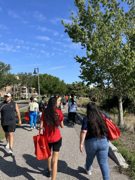 People walking near Lake Baldwin on the Orlando Kidney Walk.